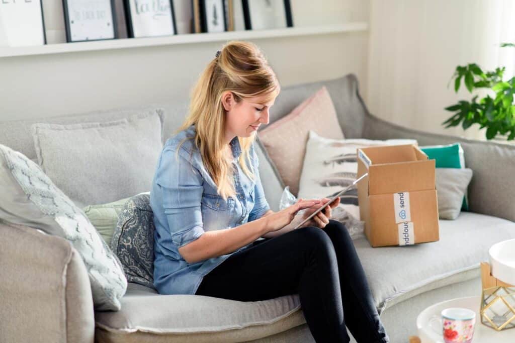 Woman reviewing return policy and shipping product
